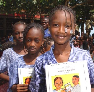 Guinea_schoolgirls Fortunately for cute children desirous of socially admirable help, much charity is not driven by altruism (picture: Laura Lartigue)